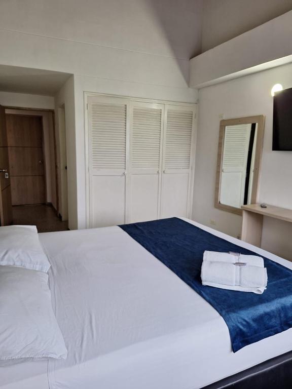 Postel nebo postele na pokoji v ubytování Hotel Suramericana