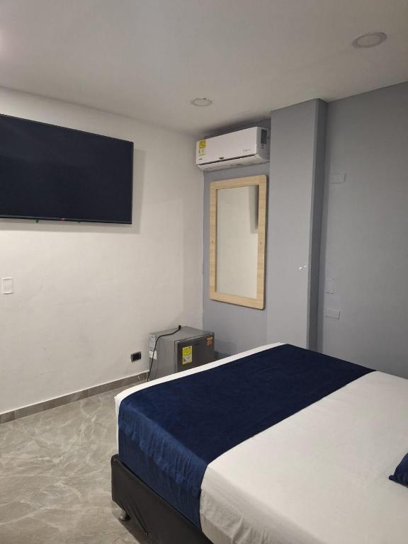 Postel nebo postele na pokoji v ubytování Hotel Suramericana