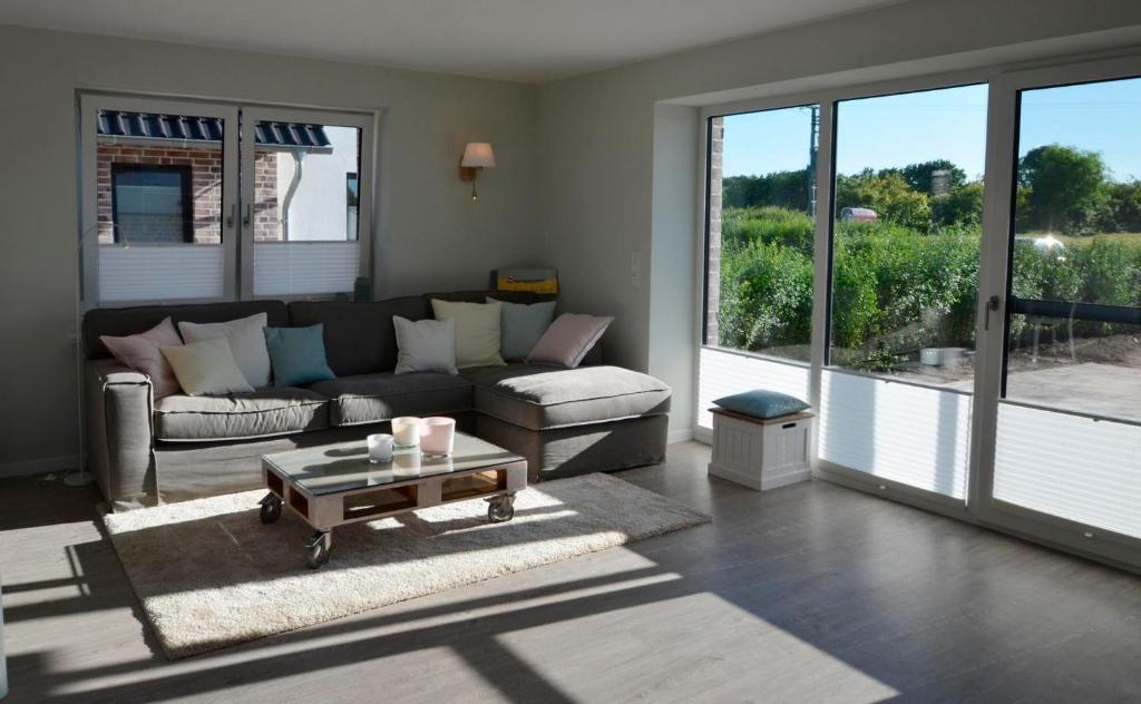 a living room with a couch and a coffee table at Småland in Kronsgaard