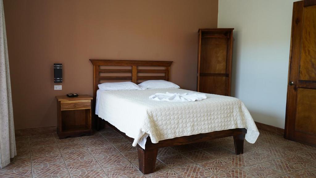 Postel nebo postele na pokoji v ubytování Hotel Pacuare