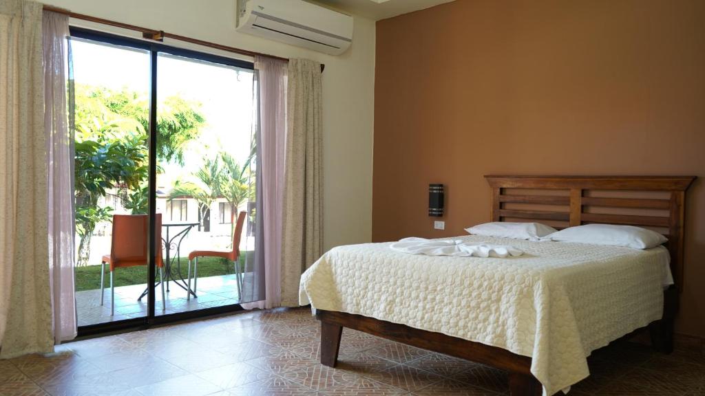 Postel nebo postele na pokoji v ubytování Hotel Pacuare