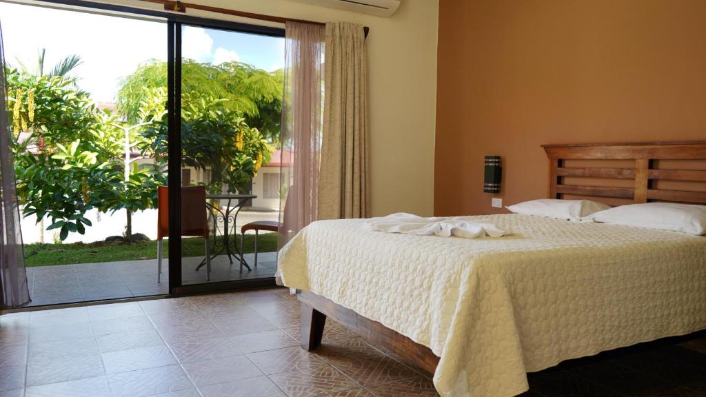 Postel nebo postele na pokoji v ubytování Hotel Pacuare