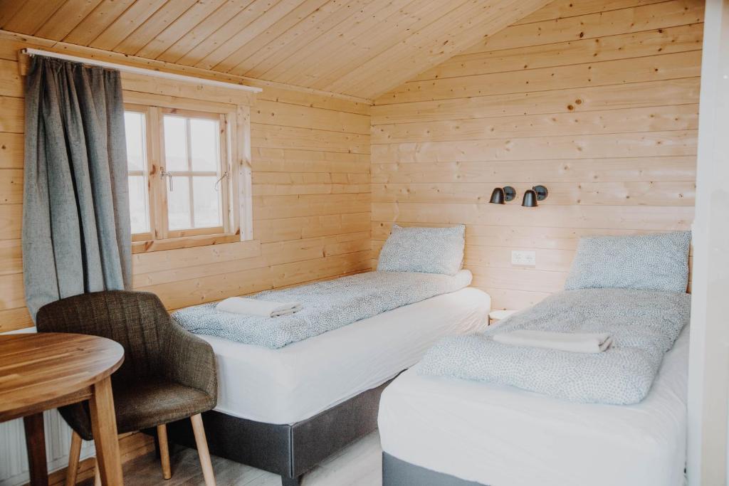 Postel nebo postele na pokoji v ubytování Rauðuskriður