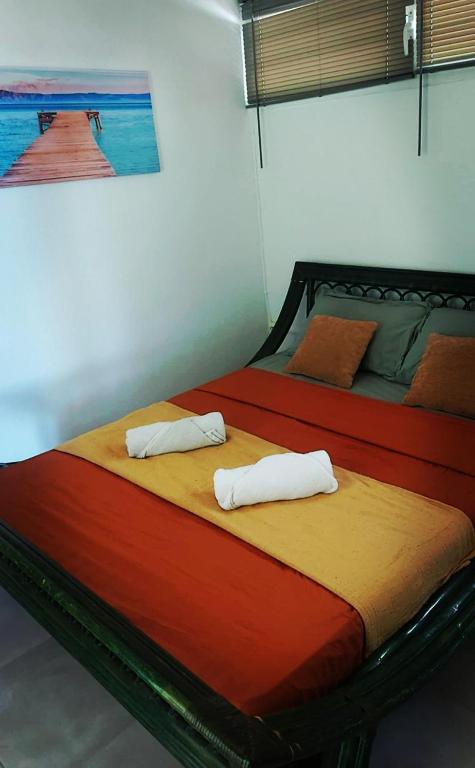 Postel nebo postele na pokoji v ubytování Villa Goyave