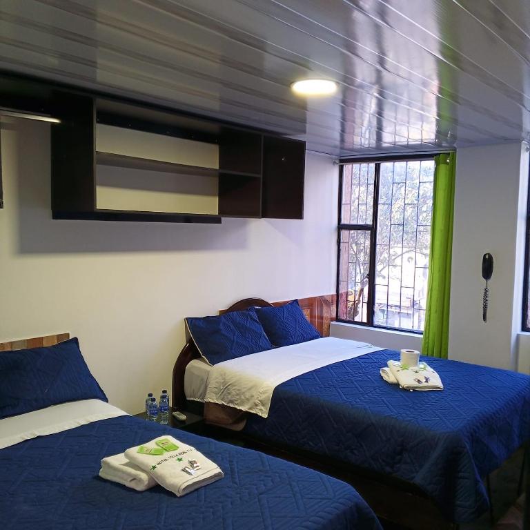 Postel nebo postele na pokoji v ubytování Hotel Villa Real