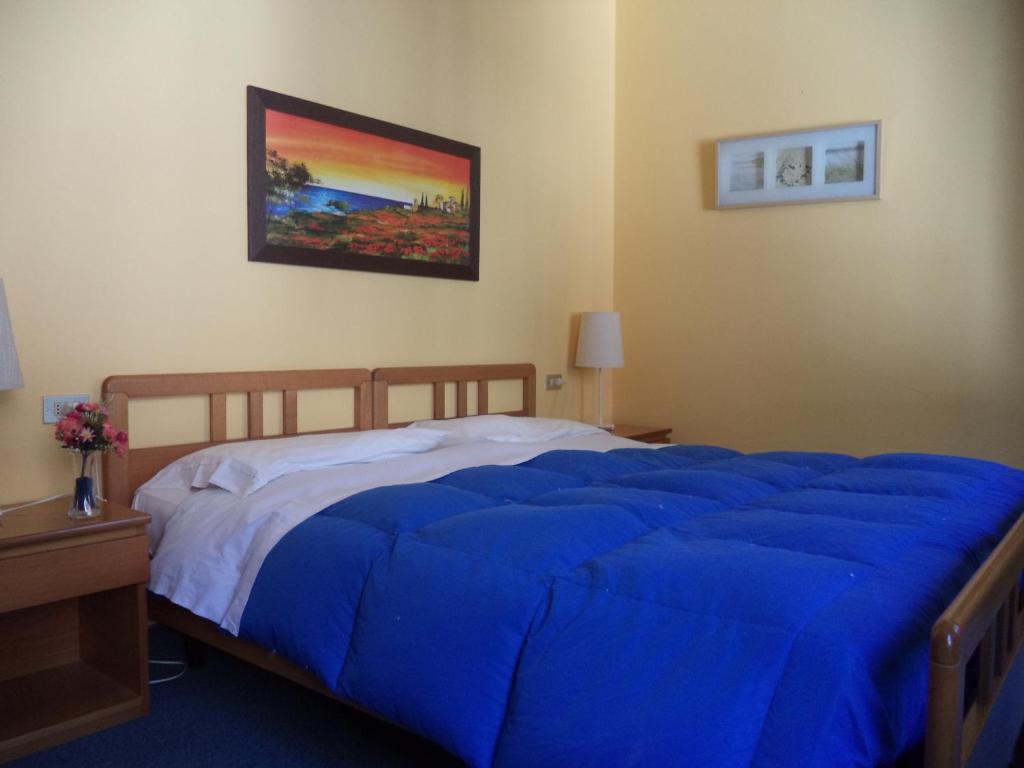 Postel nebo postele na pokoji v ubytování Hotel Il Nibbio