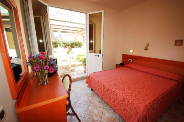 Postel nebo postele na pokoji v ubytování Hotel Bella Riviera Lungomare
