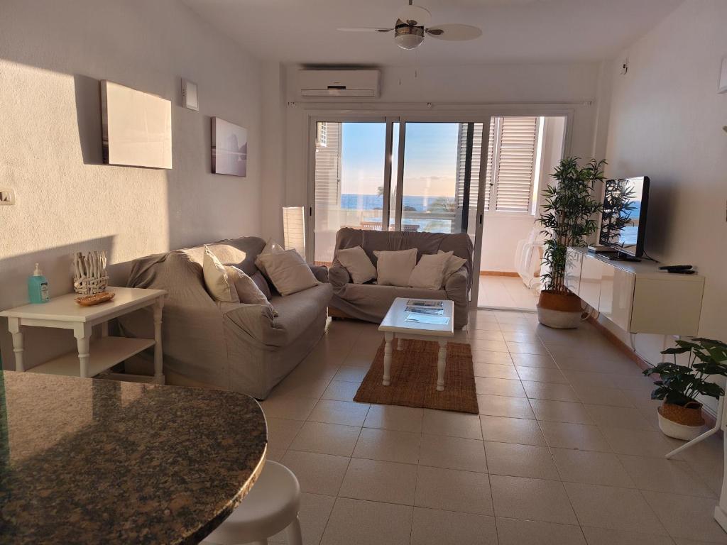 a living room with a couch and a table at Miramar Atlántico Playa in Los Llanos de Aridane