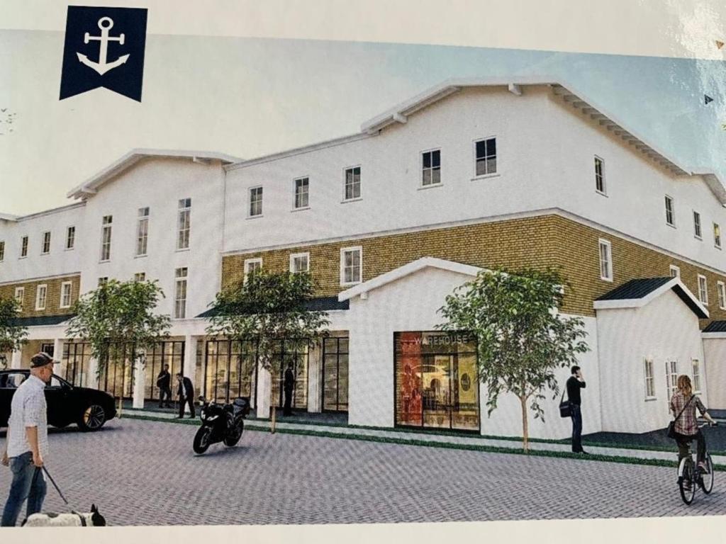 a rendering of a large white building at "Ostsee Ankerplatz" in Markgrafenheide