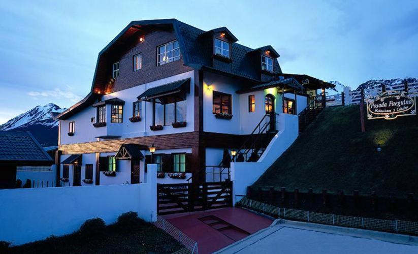 a large house with lights on top of it at Posada Fueguina in Ushuaia