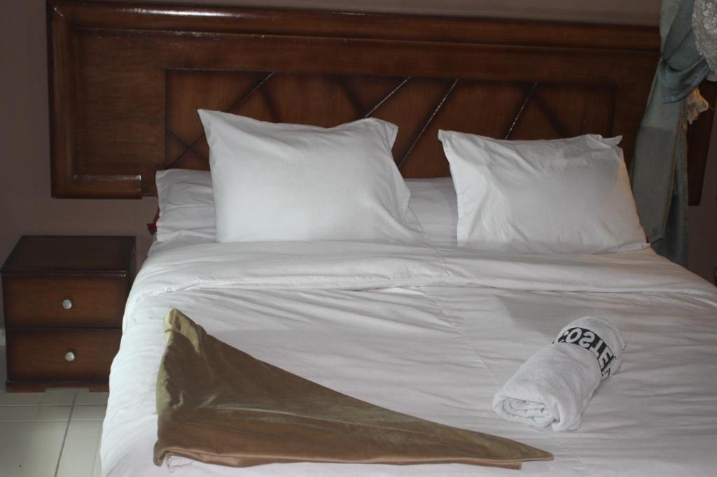 Postel nebo postele na pokoji v ubytování ALShawarbi Plaza Hotel