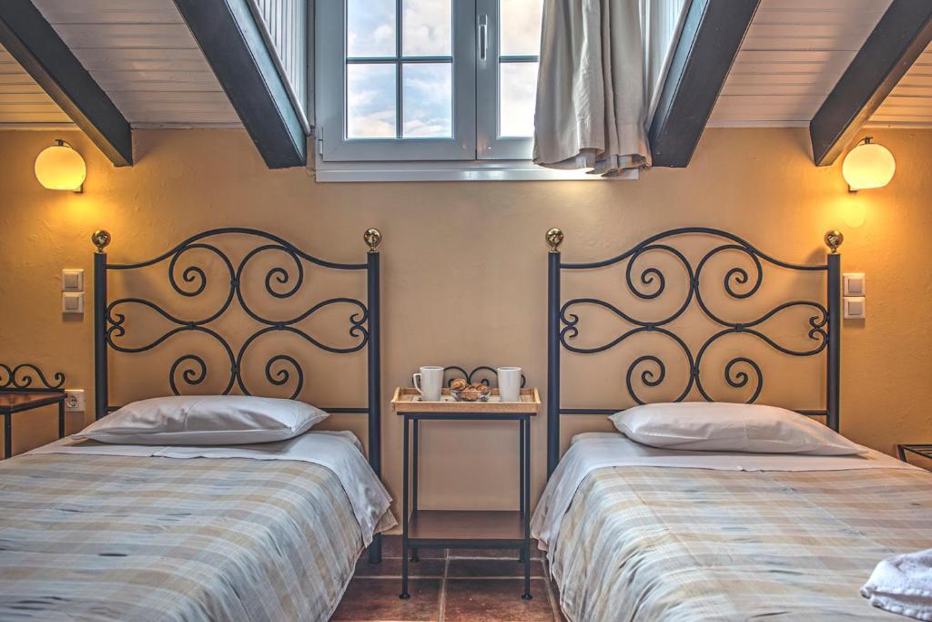 Postel nebo postele na pokoji v ubytování Legends Hotel Sidari Corfu