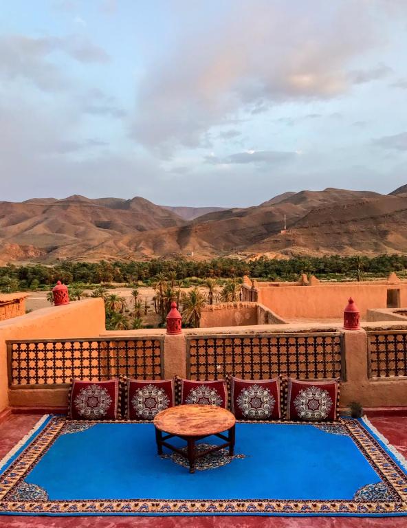 a view of the desert from the balcony of a house at Riad La Perle Tamnougalte in Agdz