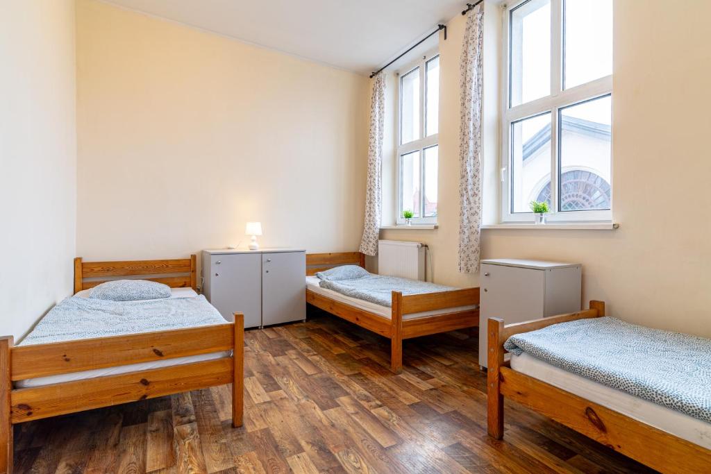 Posteľ alebo postele v izbe v ubytovaní Hostel Orange Plus