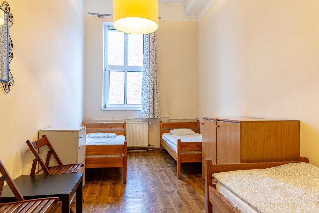 Postel nebo postele na pokoji v ubytování Hostel Orange Plus