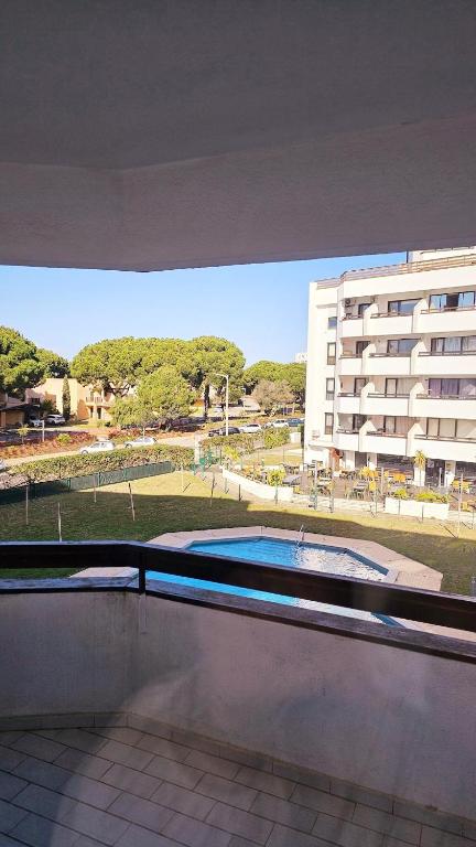 a view of a building and a swimming pool at Apartment in Vilamoura with pool in Quarteira