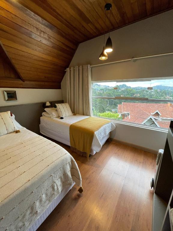 Postel nebo postele na pokoji v ubytování Pousada Cantinho da Serra