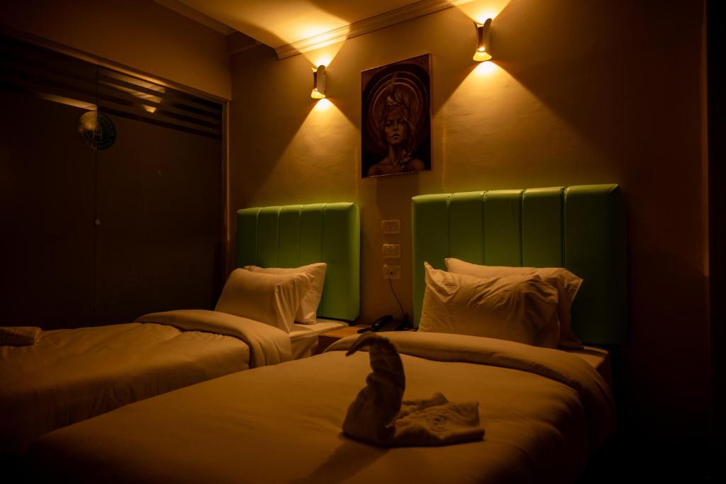 Postel nebo postele na pokoji v ubytování Soft Hotel