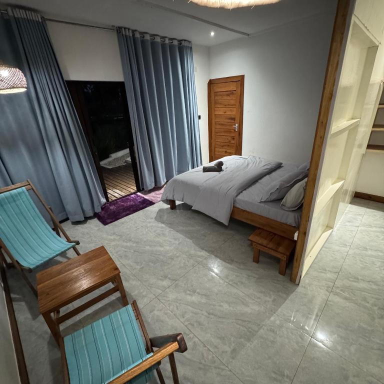 Postel nebo postele na pokoji v ubytování CosyBe Villas