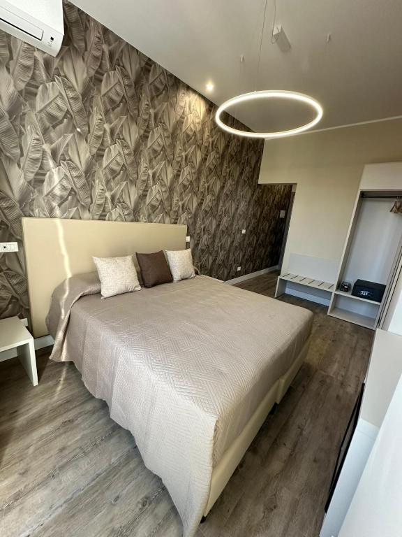 Łóżko lub łóżka w pokoju w obiekcie TrevInn Suites