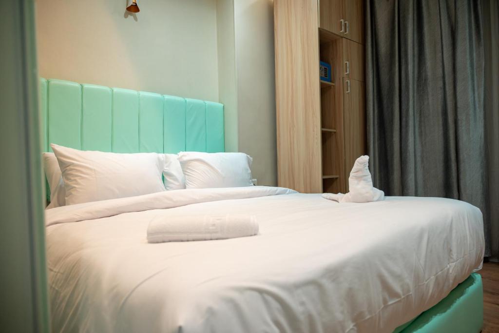 Postel nebo postele na pokoji v ubytování Soft Hotel