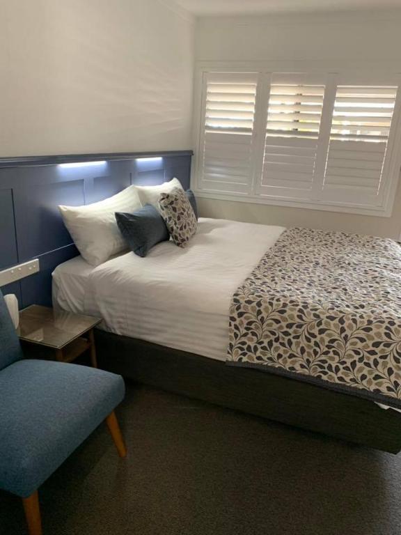 Postel nebo postele na pokoji v ubytování Granite Belt Motel