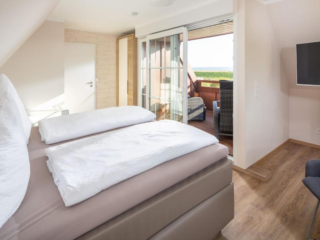 Postel nebo postele na pokoji v ubytování Seemannsgarn Comfortable holiday residence