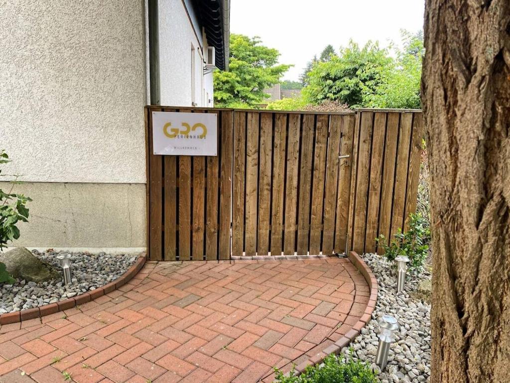 a sign on a fence in front of a house at GRO-Holiday home Comfortable holiday residence in WÃ¶lpinghausen