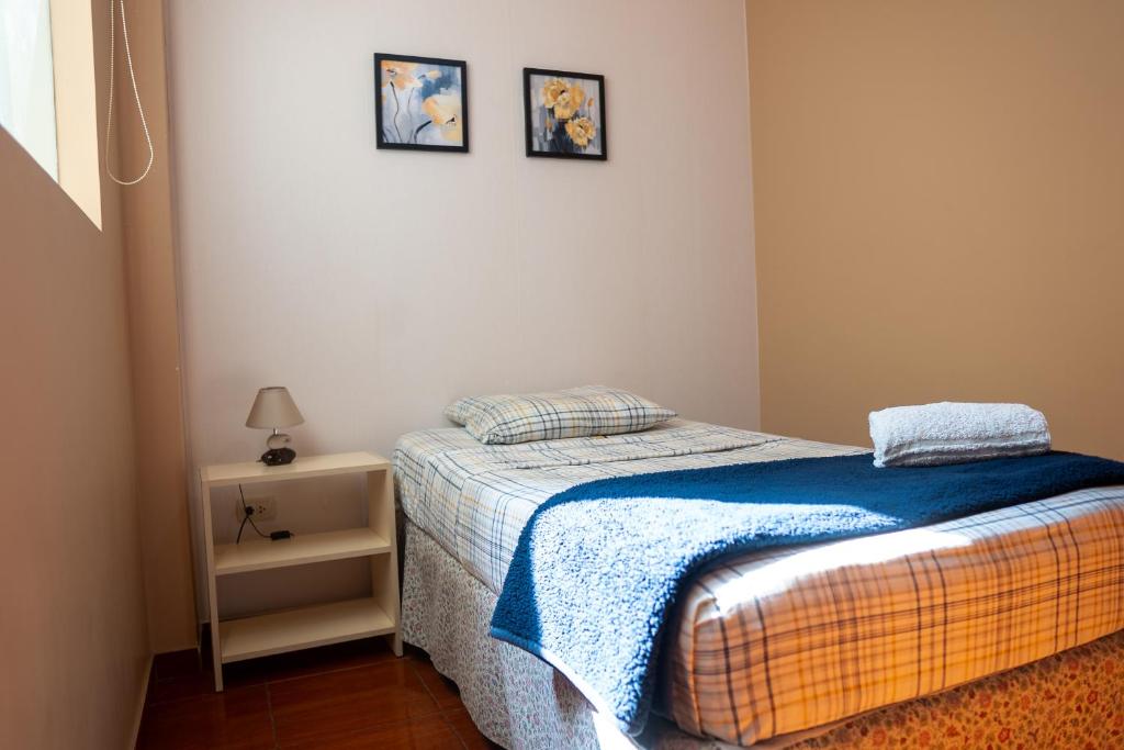 Postel nebo postele na pokoji v ubytování TruGarden Hotel Trujillo