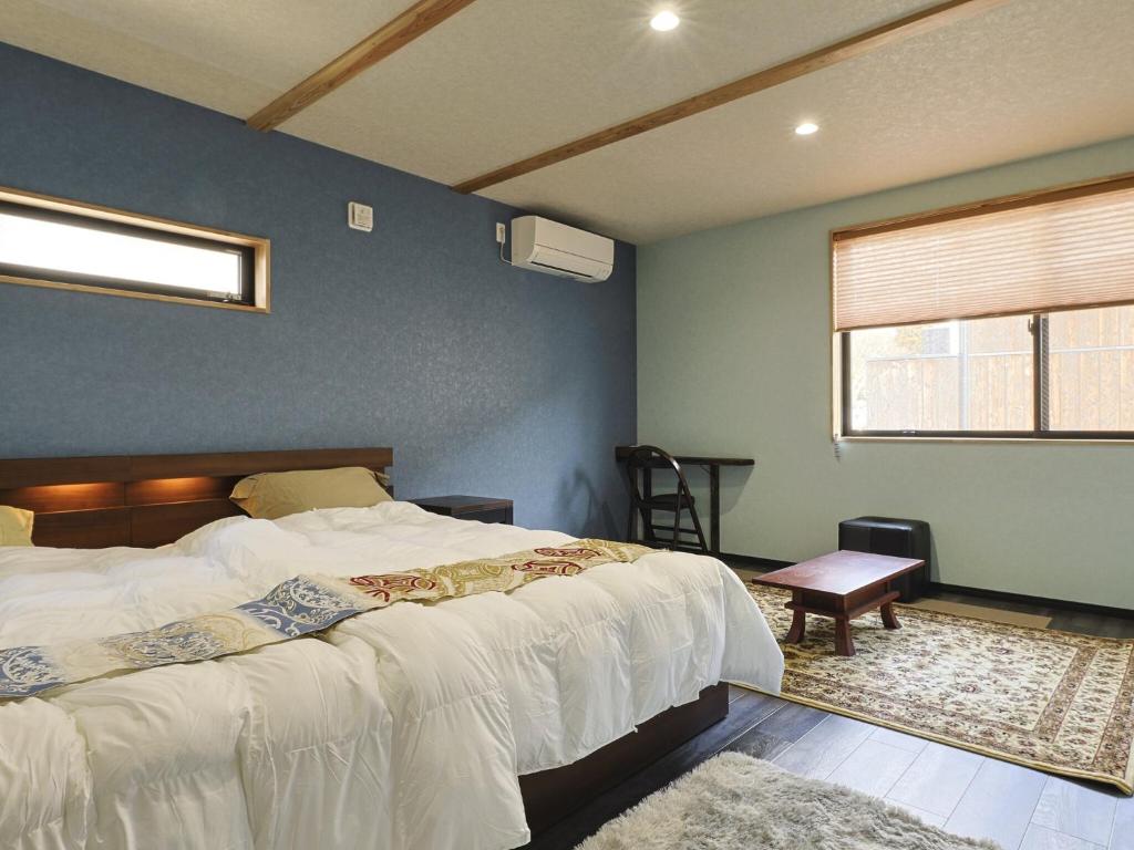 Postel nebo postele na pokoji v ubytování 籠屋mizunotoオーベルジュ