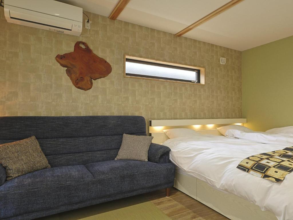 Postel nebo postele na pokoji v ubytování 籠屋mizunotoオーベルジュ