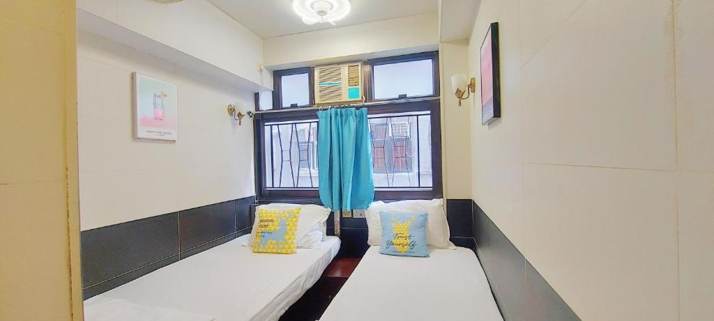 Postel nebo postele na pokoji v ubytování 吉祥賓館 Fortune Inn