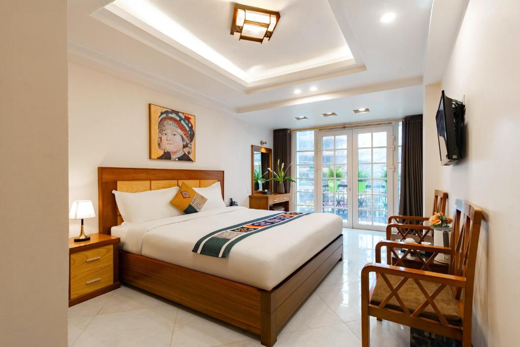 Postel nebo postele na pokoji v ubytování Sapa Paradise Hotel