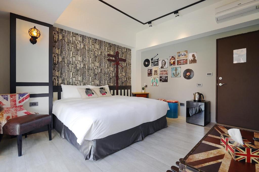 Postel nebo postele na pokoji v ubytování 默臨文旅 台中逢甲館 Morning INN