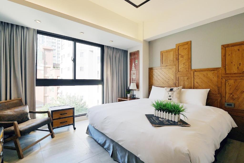 Postel nebo postele na pokoji v ubytování 默臨文旅 台中逢甲館 Morning INN