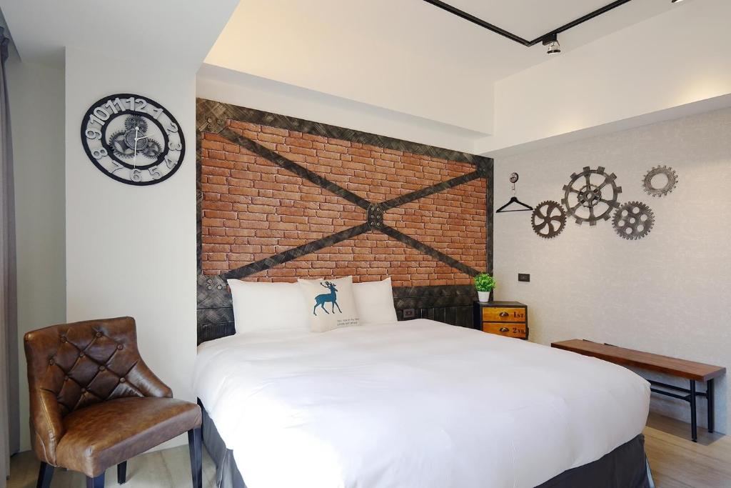 Postel nebo postele na pokoji v ubytování 默臨文旅 台中逢甲館 Morning INN