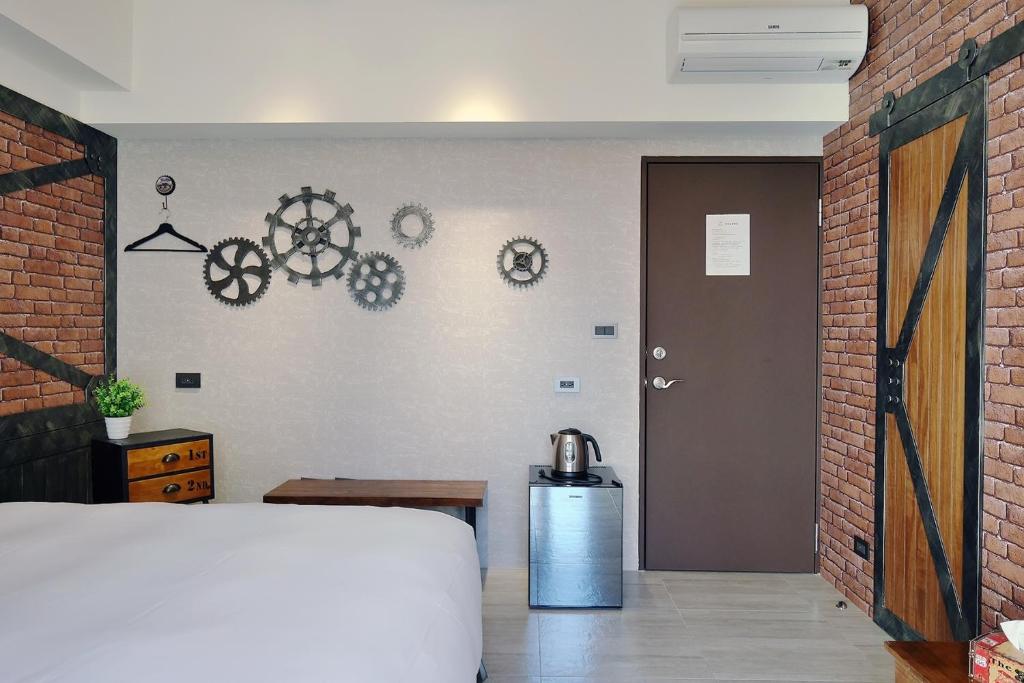Postel nebo postele na pokoji v ubytování 默臨文旅 台中逢甲館 Morning INN