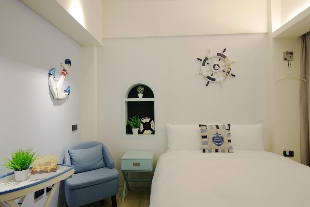 Postel nebo postele na pokoji v ubytování 默臨文旅 台中逢甲館 Morning INN