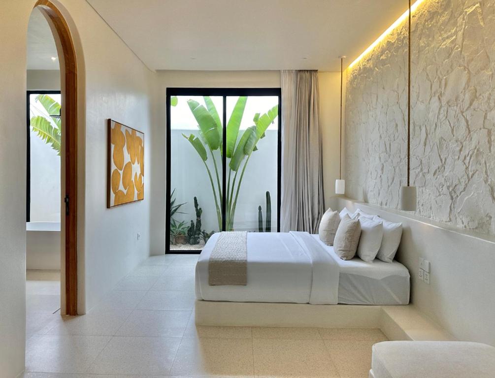 Postel nebo postele na pokoji v ubytování Dolce villas in Bingin