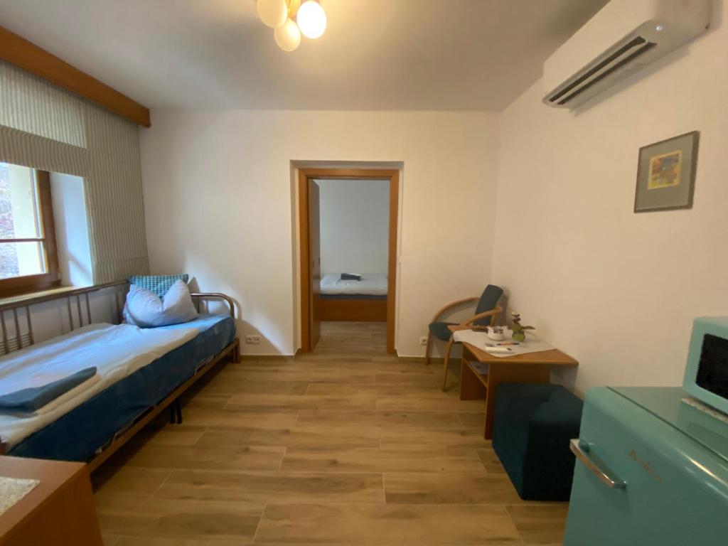 Postel nebo postele na pokoji v ubytování Samoobslužný hotel Vydra
