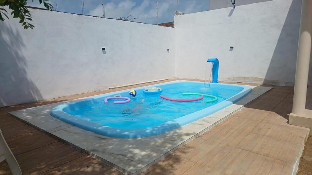 a swimming pool in the middle of a room at Recanto do Ze Bonito in Conde