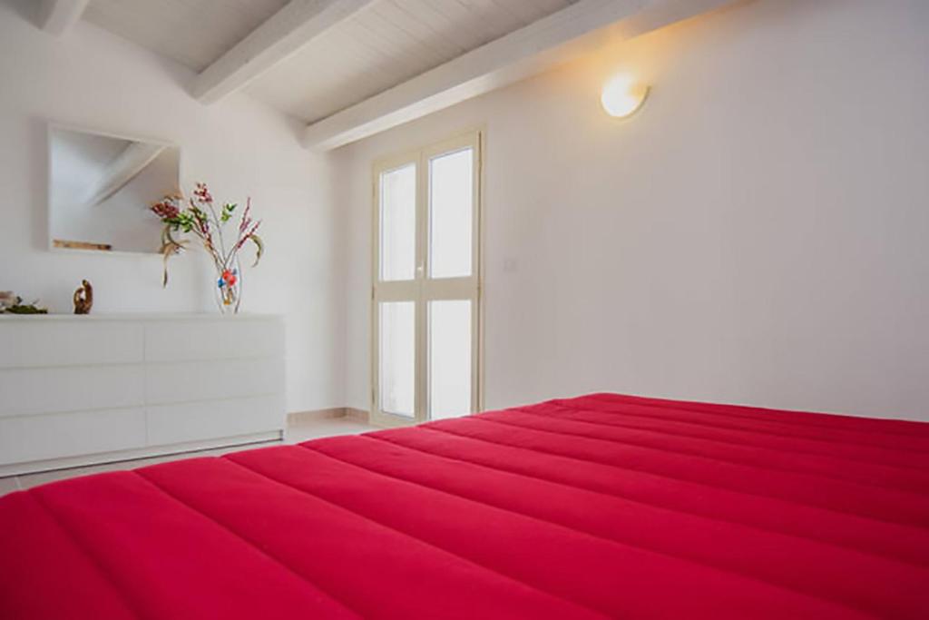 Voodi või voodid majutusasutuse La Giara - holiday apartments toas