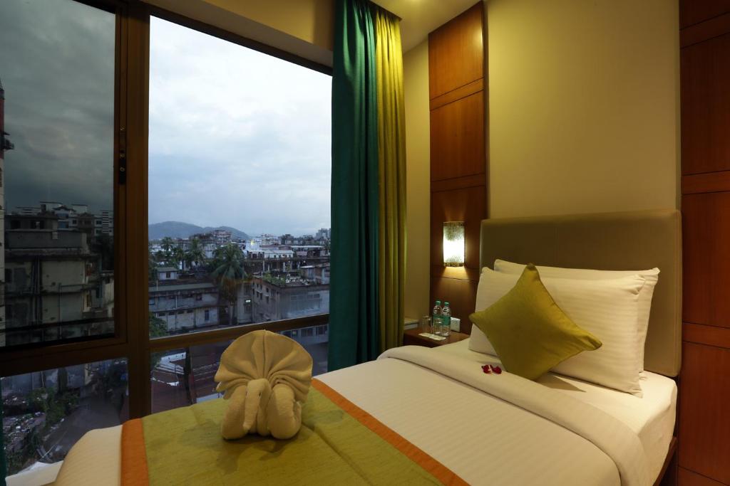 Postel nebo postele na pokoji v ubytování Hotel Aerostay IGI Delhi Airport