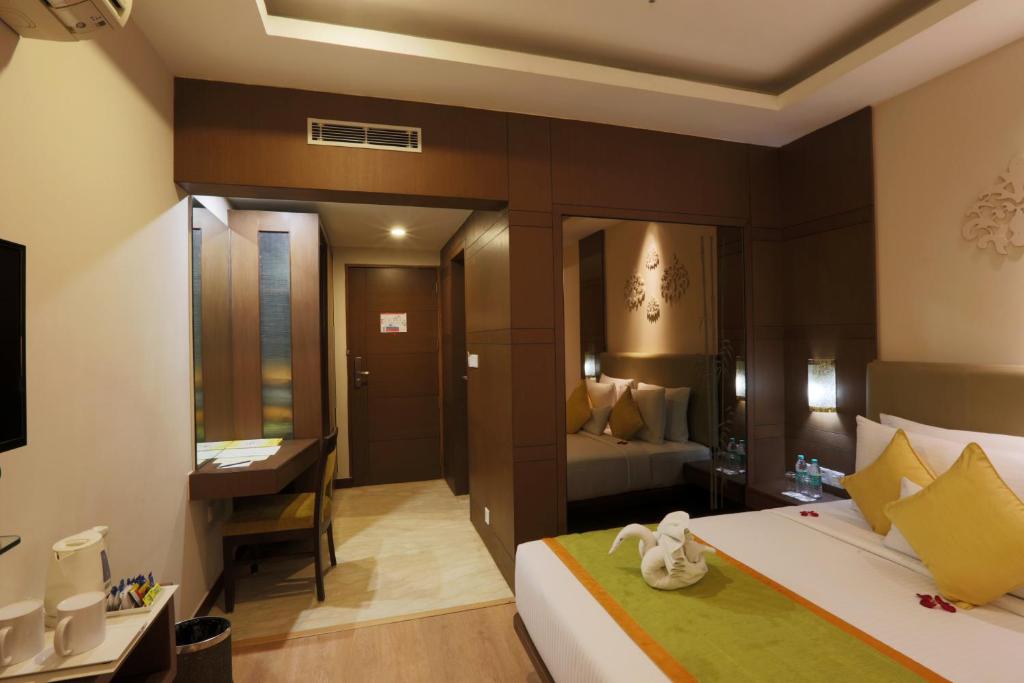 Postel nebo postele na pokoji v ubytování Hotel Aerostay IGI Delhi Airport