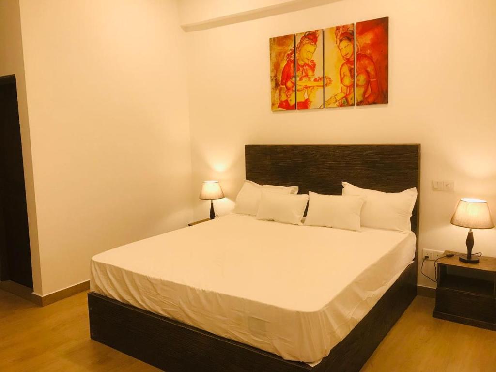 Postel nebo postele na pokoji v ubytování Lucky Transit Hotel - Katunayake Airport