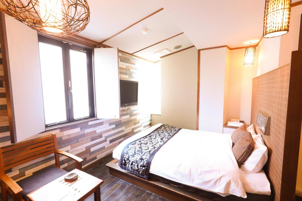 Postel nebo postele na pokoji v ubytování HOTEL B-Girl