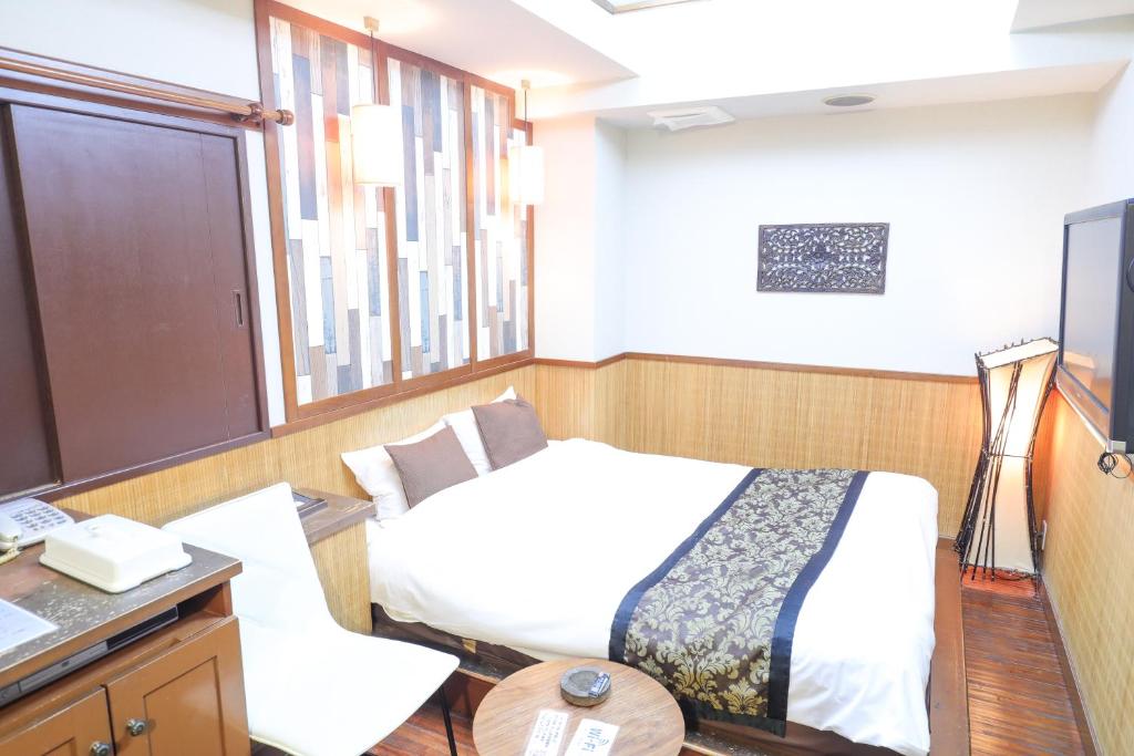 Postel nebo postele na pokoji v ubytování HOTEL B-Girl
