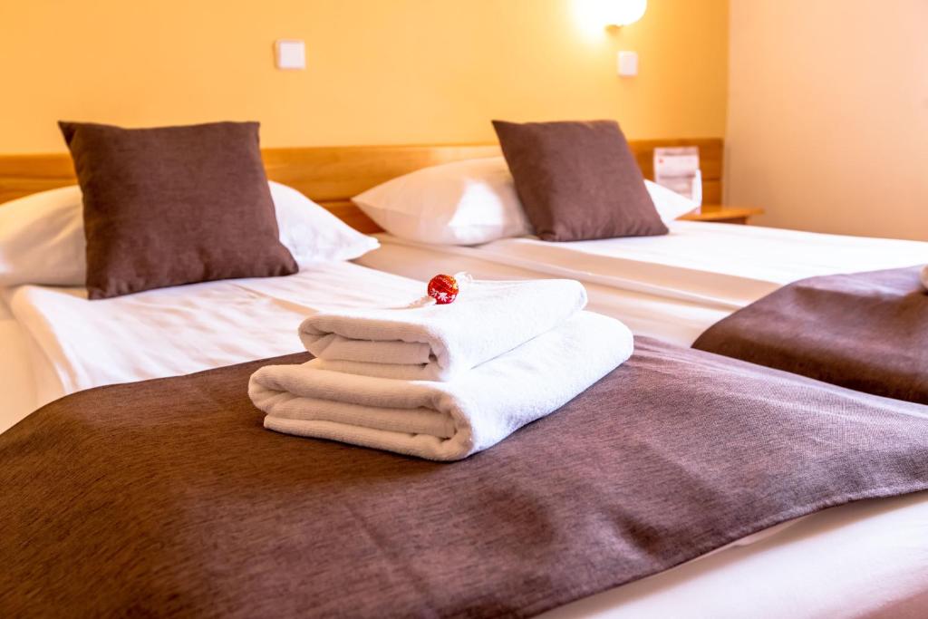 Voodi või voodid majutusasutuse B&B Bau toas