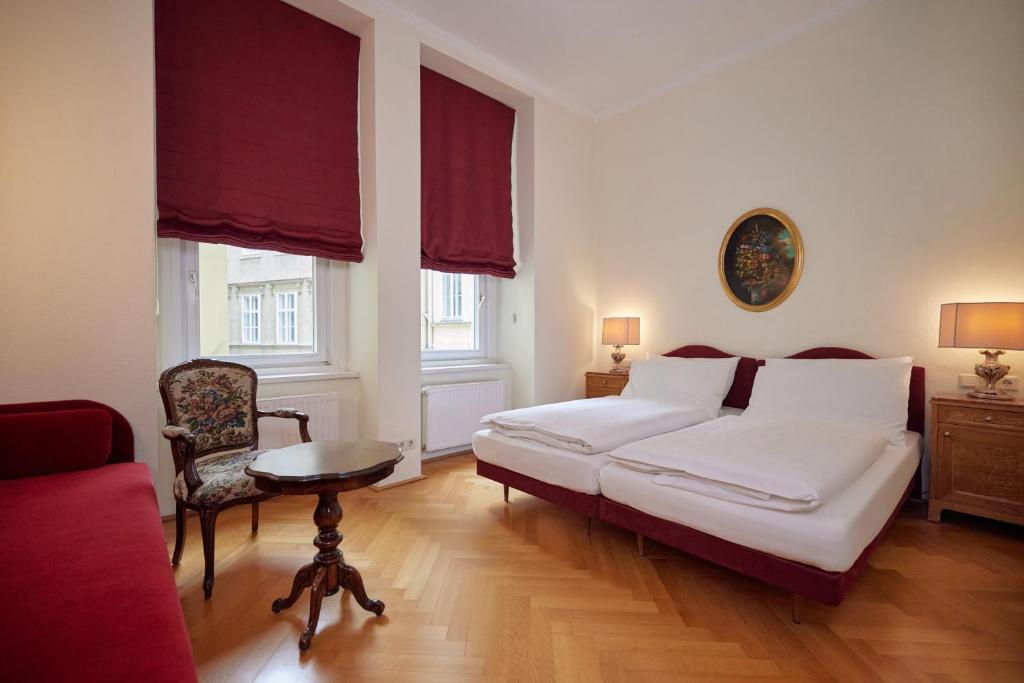Łóżko lub łóżka w pokoju w obiekcie Hotel Regina