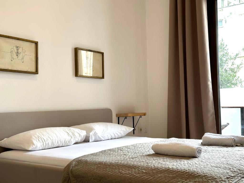 Postel nebo postele na pokoji v ubytování Guest house Kamelija
